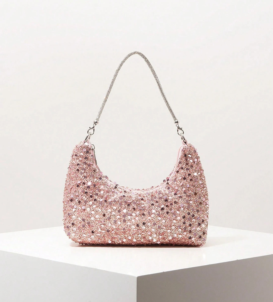 Bolso de lentejuelas en oro rosa
