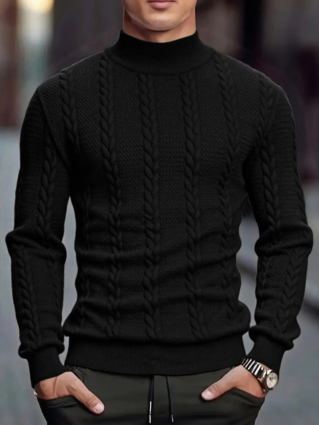Hombre con el jersey negro de ochos y cuello perkins con pantalón oscuro