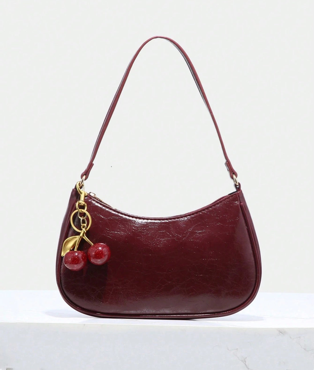Bolso baguette en burdeos
